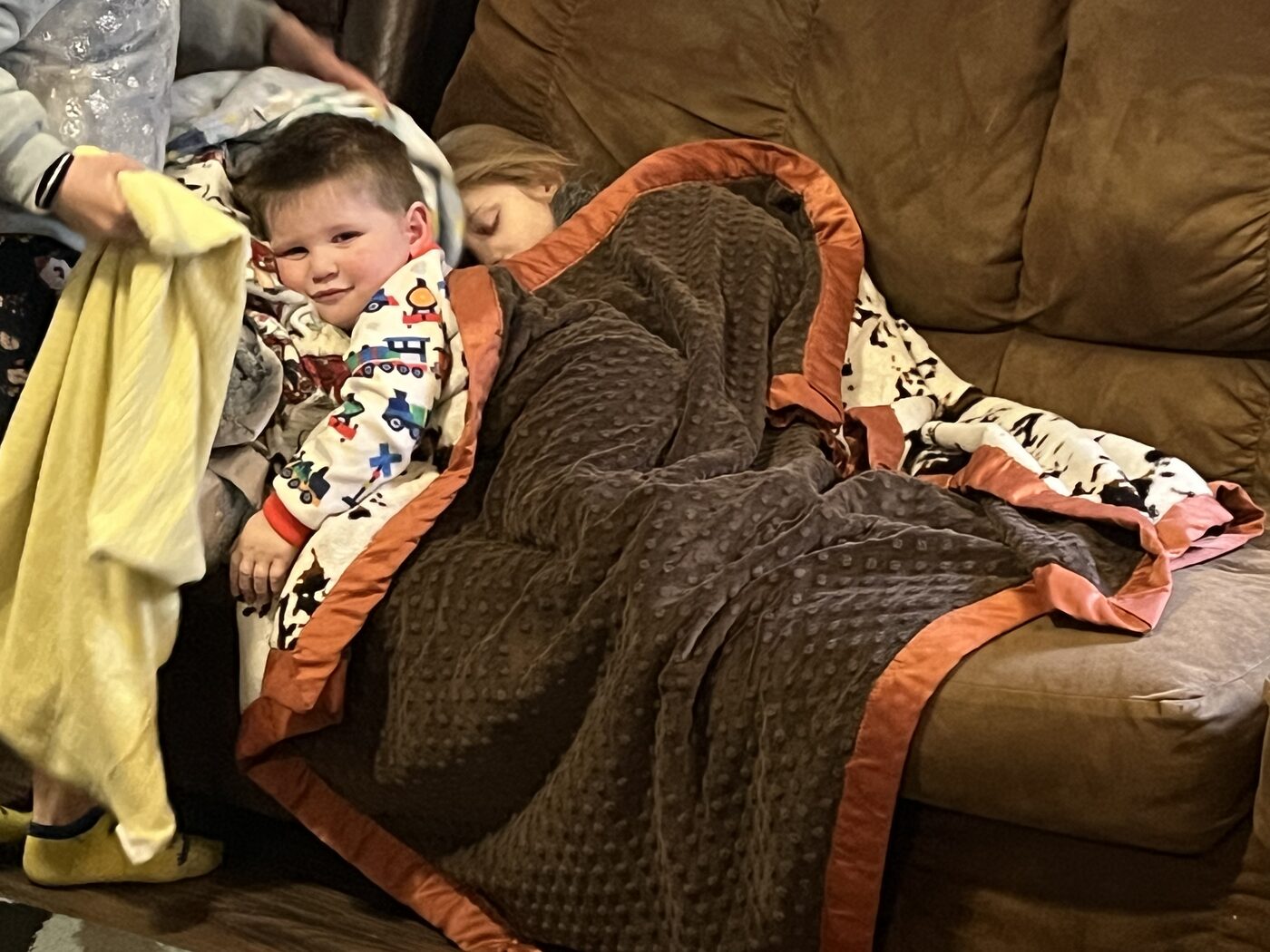 Child cozy under a handmade blanket